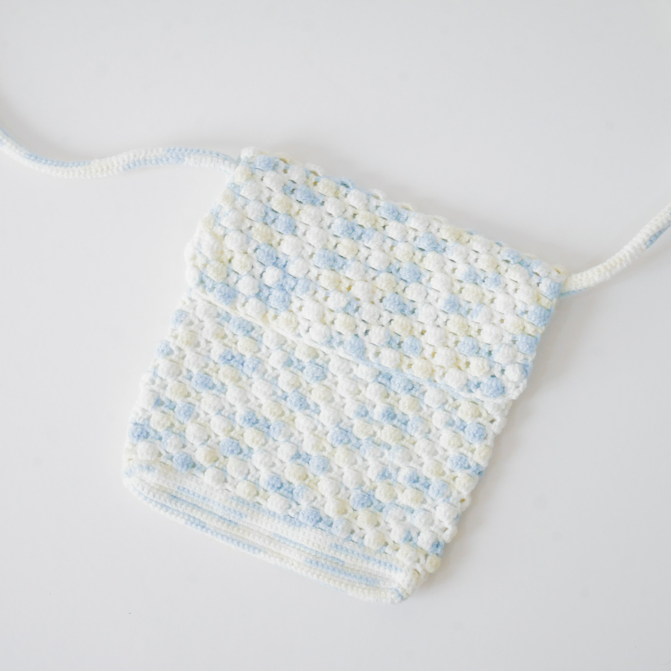 Azora Pom Pom Sling Bag
