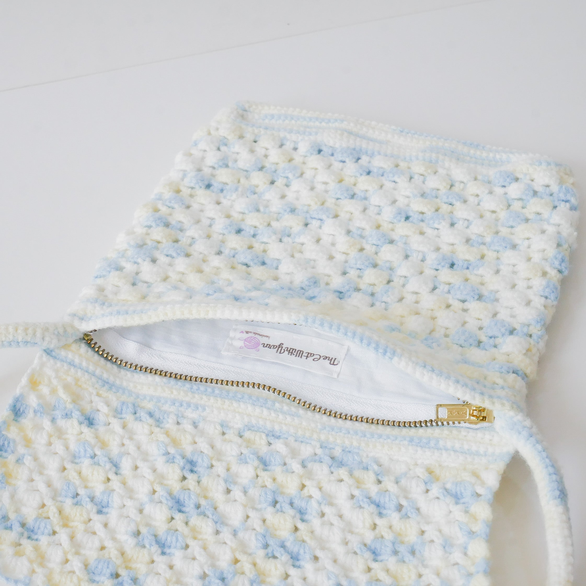 Azora Pom Pom Sling Bag