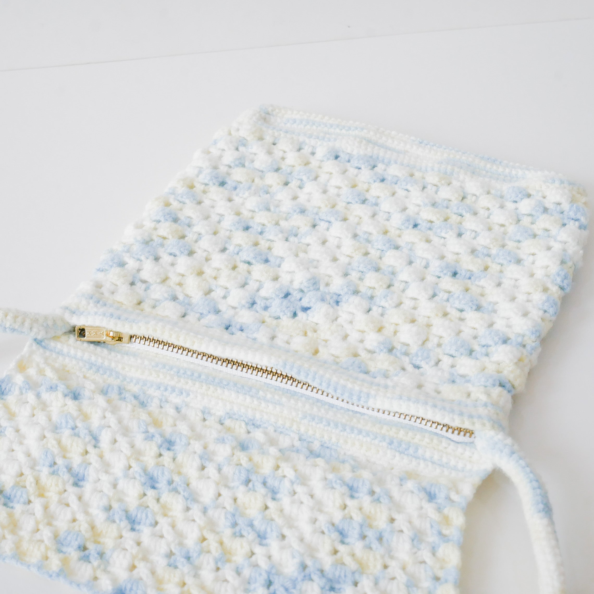 Azora Pom Pom Sling Bag